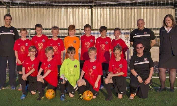 Junior footballers take to the field with funeral firm